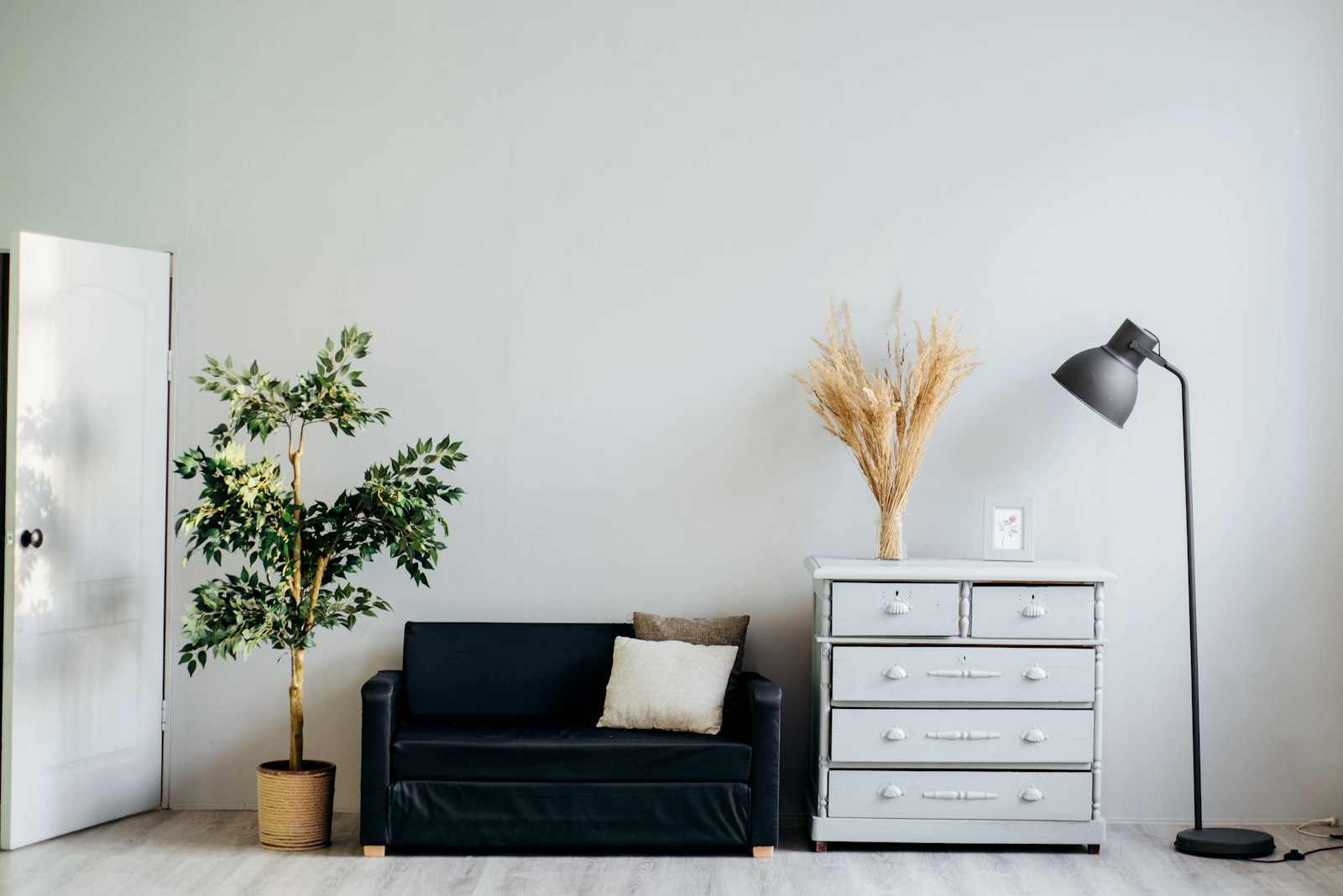 Minimalist room wall with freshly painted finish and sideboard