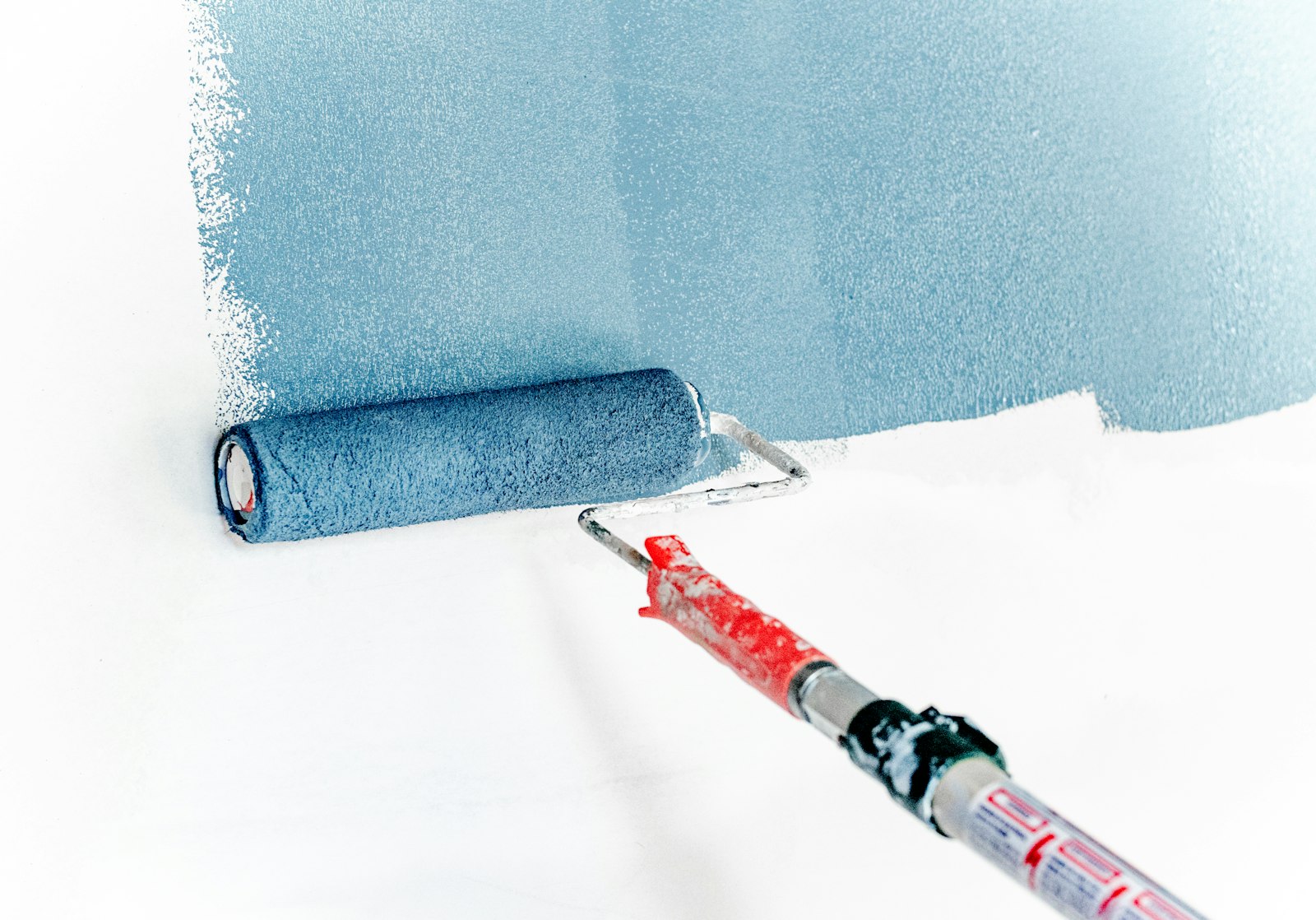 Roller painting clean smooth colour on an interior wall